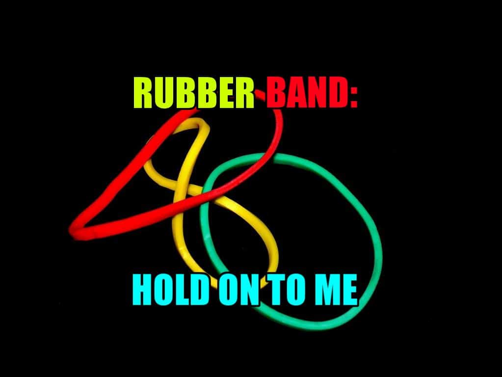 Red, green, and blue rubber bands set against a black background.