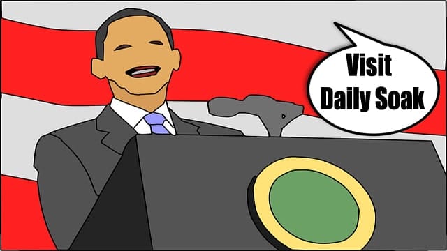 Cartoon of President Obama with no nose standing in front of American flag.
