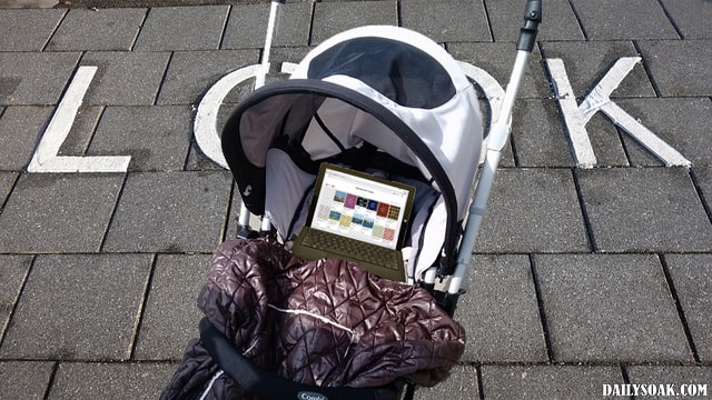 Baby stroller with Microsoft laptop in it instead of baby.