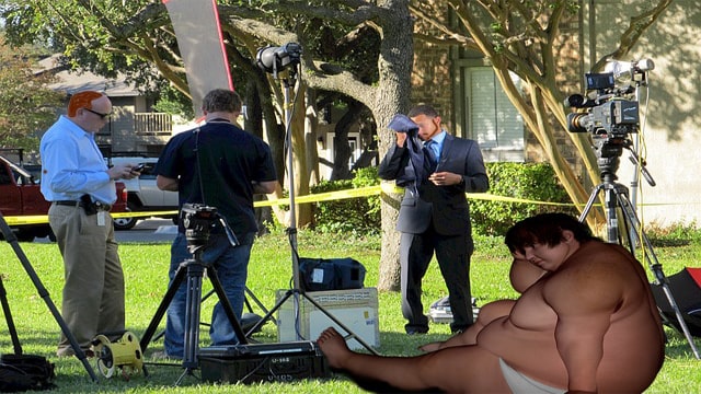 Naked obese man sitting on lawn in front of camera crew in protest.