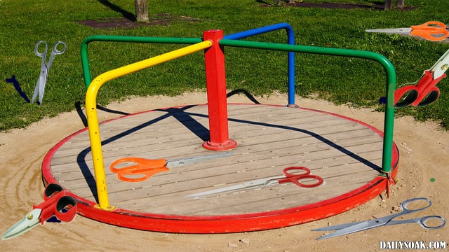 Children's playground with scissors lying everywhere.