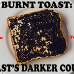 Piece of burnt toast on a white plate.