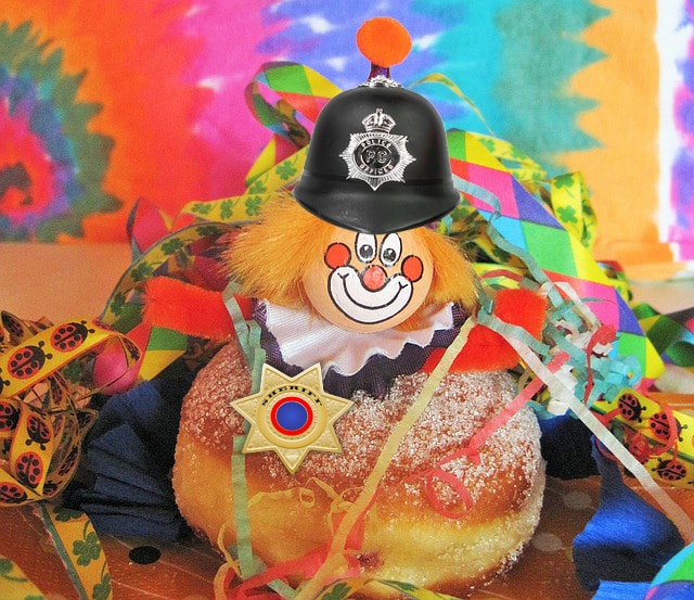 Donut wearing police hat and badge.