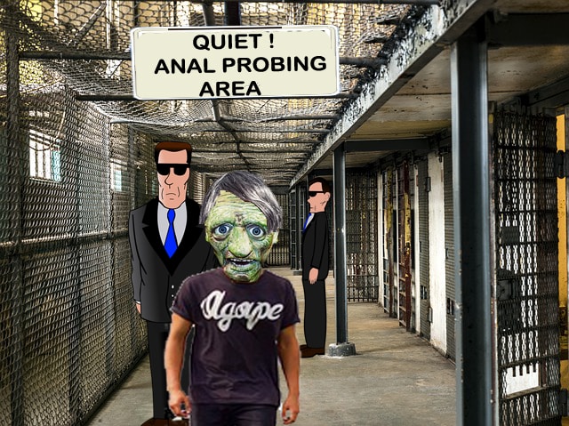 Man in green-face being led into a jail cell by men in black.