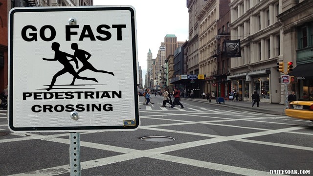 Parody pedestrian crossing sign in New York.