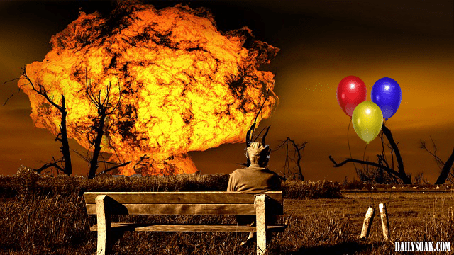 Old man sitting on bench watching a fiery explosion.