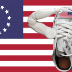 Betsy Ross shoe saluting the USA flag.