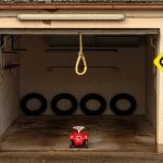 Open garage door with pull rope hanging.