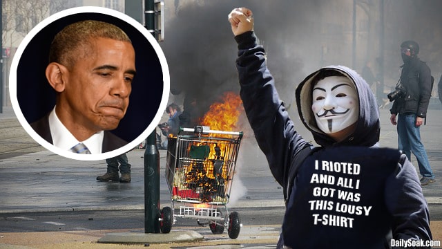 Man wearing mask and black clothes burning shopping cart.