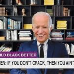 Joe Biden wearing suit in front of bookshelf.