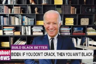 Joe Biden wearing suit in front of bookshelf.