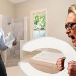Hillary and Bill Clinton standing inside white bathroom.
