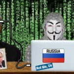 Joe Biden and anonymous hacker at laptop behind desk.