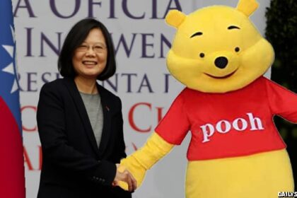 Winnie the Pooh bear standing in front of red, white, and blue Taiwan flag shaking hands with Taiwanese president.