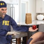 FBI agent wearing blue jacket screaming at scared woman inside kitchen.