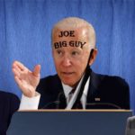 Joe Biden, Nancy Pelosi, and Kamala Harris giving press briefing in front of blue curtain.