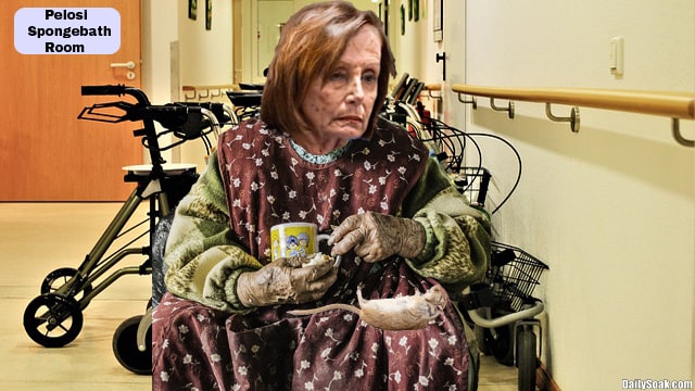 Nancy Pelosi wearing red shawl and drinking cup of coffee.