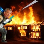 Bill de Blasio wearing fireman suit while putting out smoldering house fire.