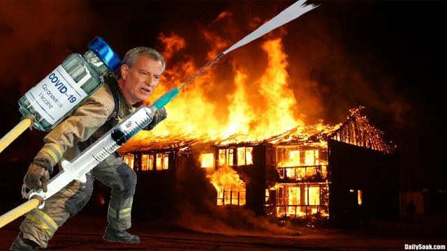 Bill de Blasio wearing fireman suit while putting out smoldering house fire.