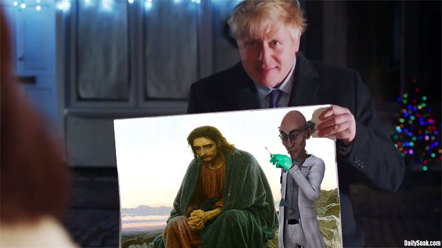 Boris Johnson holding large photo of Jesus on Christmas.
