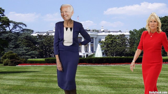 Joe Biden wearing a blue dress while standing on the White House lawn grass.