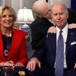 Parody photo showing Joe Biden sniffing the hair of Joe Biden while on the couch.