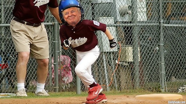 Donald Trump wearing a Little League Baseball uniform on field.