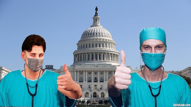 Two healthcare workers in blue scrubs standing in front of Washington Capitol.