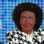 Parody of Hillary Clinton wearing blackface as a black woman.