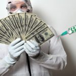 Doctor in white lab coat holding money while reciting the Hippocratic Oath.