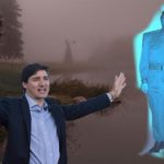 Justin Trudeau in blue jacket outside in a dark Canada swamp.