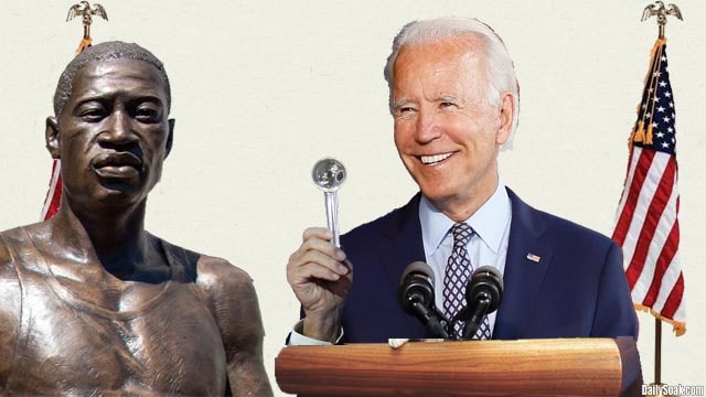 Joe Biden standing next to a George Floyd statue.