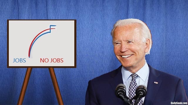 Joe Biden standing next to a chart of job creation numbers.