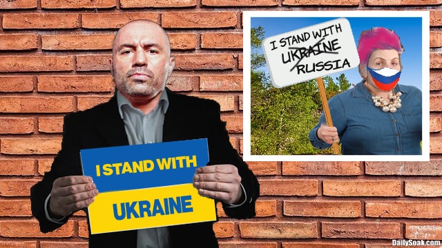 Joe Rogan wearing suit and holding sign with Ukraine flag.