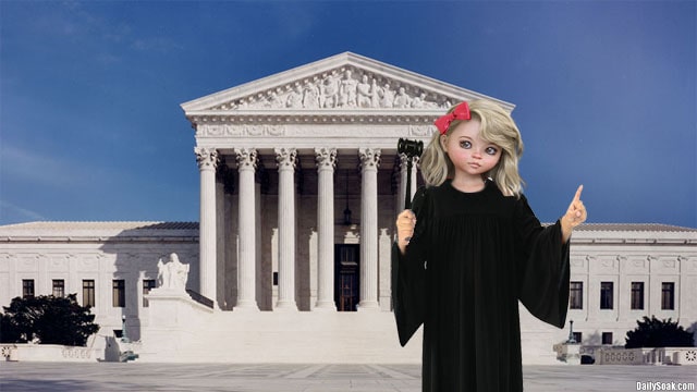 Young blonde girl wearing black Supreme Court robe.