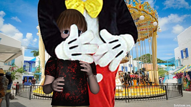 Disney's Mickey Mouse grabbing child by the face inside Disneyland.
