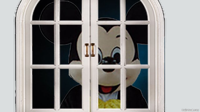 Disney Mickey Mouse rodent staring into bedroom at night.