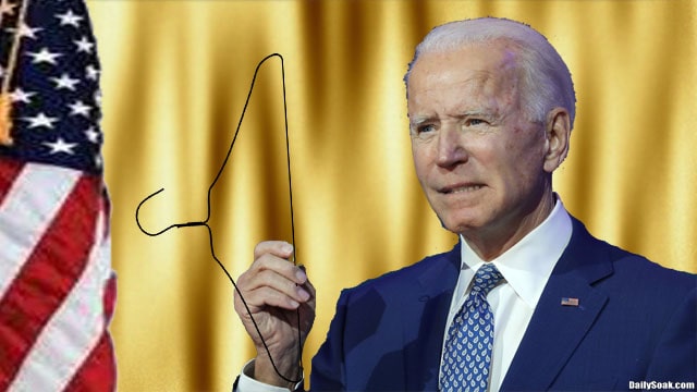 Joe Biden holding up clothes hanger during White House speech.