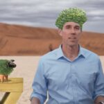 Beto O'Rourke standing next to a Chia Pet in the Texas desert.