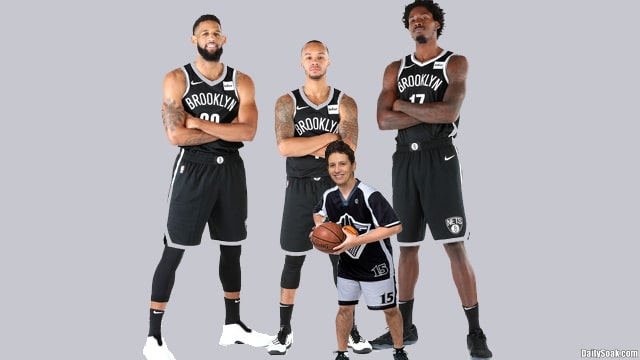 Kyrie Irving and NBA Brooklyn Nets players standing in team lineup.