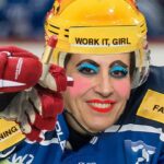 NHL hockey players wearing makeup on ice to support trans community.