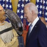 Joe Biden handing citizens medal to Hannibal Lecter.