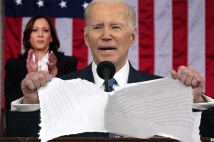 Joe Biden ripping up State of the Union speech papers.
