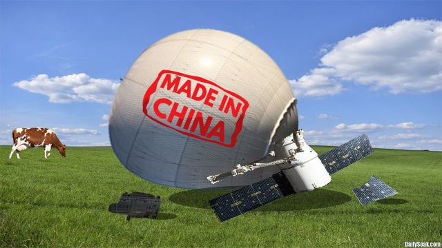 White Chinese spy balloon sitting on a green field in Montana.