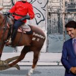 Justin Trudeau watching a Canada Mountie police officer trample on horse trampling protester.