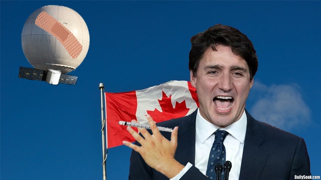 Canada Prime Minister Justin Trudeau holding COVID vaccine syringe in front of UFO balloon.