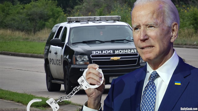 Joe Biden holding handcuffs while standing in front of a police squad car.