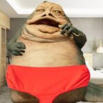 Jabba the Hutt wearing red underwear in his bedroom in front of a photo of Lizzo.