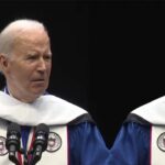 President Joe Biden wearing blue robe speaking at black college.