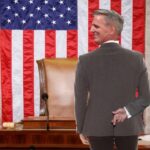 House Speaker Kevin McCarthy standing inside House of Representatives chambers.